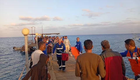 epa11739995 Medics and people wait for possible survivors after a boat sank at a harbour in Marsa Alam, Red Sea Governorate, in Egypt 25 Novermber 2024. Red Sea Governor Major General Amr Hanafi reported that rescue efforts had successfully rescued 28 people from the tourist launch 'Sea Story' sinking accident north of Marsa Alam thus far. Searches are still underway to locate the other 17 passengers who have gone missing. EPA/STR
