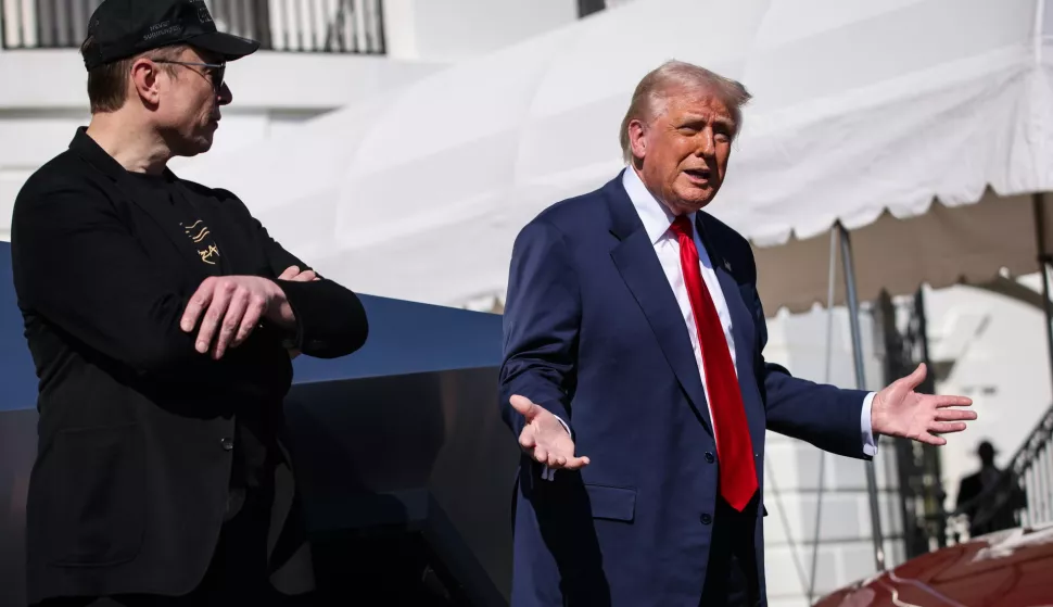 epa11957116 US President Donald Trump (R) speaks in front of a group of Tesla vehicles with Tesla CEO and Senior Advisor to the President of the United States Elon Musk (L) and his son, X, on the South Lawn of the White House in Washington, D.C., USA, 11 March 2025. President Trump has said he will buy a Tesla to support Tesla and Elon Musk after recent attacks on Tesla charging stations and calls for boycotts of Tesla products. EPA/SAMUEL CORUM/POOL