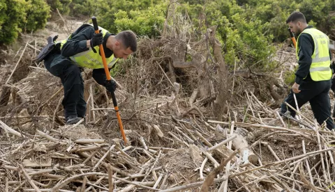 epa12022139 Civil Guard agents search for the bodies of three people in Riba-roja de Turia, Valencia, Spain, 10 April 2025, that are still missing since the October 2024 floods in Valencia. More than five months after the flash floods triggered by the DANA (high-altitude isolated depression) weather phenomenon that hit the east of the country on 29 October 2024, in which more than 200 people died, recovery and reconstruction efforts are still ongoing as three people remain missing. EPA/Kai Forsterling