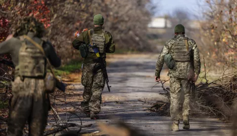 epa10286029 Ukrainian soldiers move along a street in the northern Kherson region, 04 November 2022. The city of Kherson on the Black Sea coast was seized by Russia in the first month after its invasion of Ukraine on 24 February. Now it appears that Russia might be about to give up at least part of it as it prepares defensive lines for the winter. Russian troops on 24 February entered Ukrainian territory, starting a conflict that has provoked destruction and a humanitarian crisis. EPA/HANNIBAL HANSCHKE