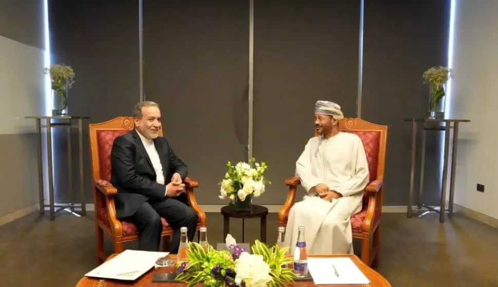 epa12026480 A handout photo made available by the Iranian Foreign Ministry shows Iranian Foreign Minister Abbas Araghchi (L) talking with his Omani counterpart Barr Bin Hamed Al Busaidi in Muscat, Oman, 12 April 2025.Top Iranian and US officials will hold indirect negotiations in Oman on 12 April amid the ongoing tensions between the USA, Israel and Iran. EPA/IRANIAN FOREIGN MINISTRY HANDOUT EDITORIAL USE ONLY/NO SALES