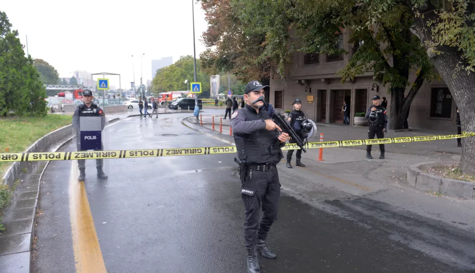 epa10893364 Turkish police officers secure the site of an attack near the Interior Ministry in Ankara, Turkey, 01 October 2023. According to the Turkish Minister of Interior Ali Yerlikaya, two police officers were injured when two people carried a bomb attack outside the ministry's gate, adding that one of the attackers blew himself up and the other was 'neutralized' by security forces. The ministry is located close to the Turkish parliament which was due to reopen on 01 October with a speech by Turkey's President Recep Tayyip Erdogan. EPA/NECATI SAVAS