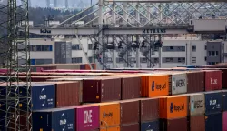 epa12031417 Containers are stacked at a transshipment terminal in Prague, Czech Republic, 14 April 2025. US President Trump initiated a trade war with most of America's trading partners, as several countries were granted a temporary tariffs exemption. EPA/MARTIN DIVISEK