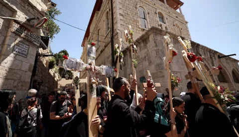 epa12038756 Christian Orthodox pilgrims hold crosses during a Good Friday procession along the Via Dolorosa in Jerusalem's Old City towards the Church of the Holy Sepulchre, 18 April 2025. The pilgrims retraced the route taken by Jesus Christ to his crucifixion through the streets of Jerusalem. EPA/ATEF SAFADI