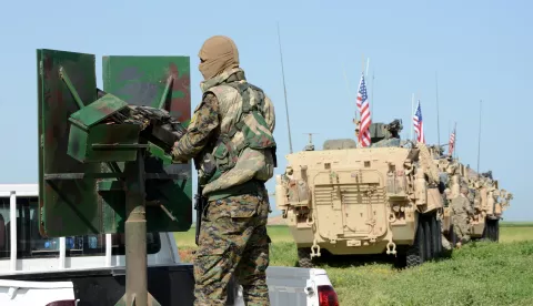 epa07274791 (FILE) - A convoy of US army troops (R) and the People's Protection Units (YPG) Kurdish militia (L) patrol near al-Ghanamya village, al-Darbasiyah town at the Syrian-Turkish border, Syria, 29 April 2017 (reissued 11 January 2019). The US-led military coalition in Syria has begun the process of withdrawing troops from Syria, a US military official said according to media reports on 11 January 2019. EPA/YOUSSEF RABIE YOUSSEF