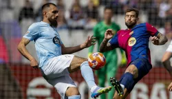 epa12040889 FC Barcelona's Inigo Martinez (R) and Celta de Vigo's Borja Iglesias vie for the ball during the Spanish LaLiga soccer match between FC Barcelona and Celta de Vigo, at Olimpic Lluis Companys Stadium, in Barcelona, Catalonia, Spain, 19 April 2025. EPA/ALBERTO ESTEVEZ