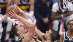 epa11259696 Denver Nuggets center Nikola Jokic (L) drives to the basket with the ball while being guarded by LA Clippers center Ivica Zubac (R) during the first quarter of the NBA basketball game between the Denver Nuggets and the Los Angeles Clippers in Los Angeles, California, USA, 04 April 2024. EPA/CAROLINE BREHMAN SHUTTERSTOCK OUT