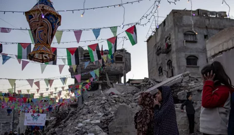 epa11931185 Palestinians hang decorations next to their destroyed homes in preparation for the holy month of Ramadan in Khan Yunis, southern Gaza Strip, 28 February 2025. The first day of Ramadan, the ninth month in the Islamic calendar, is expected to fall on 01 or 02 March 2025, depending on the sighting of the crescent moon. Muslims around the world observe the holy month of Ramadan by praying at night and abstaining from food and drink between sunrise and sunset. Ramadan is the ninth month in the Islamic calendar, and the first verse of the Quran is believed to have been revealed during the last 10 nights. EPA/HAITHAM IMAD