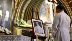 epa12044071 Filipino priest Jason Bill Valeza places a picture of Pope Francis on the altar at Christ the King Church in Las Piñas City, Metro Manila, Philippines, 21 April 2025. Pope Francis died on 21 April 2025 at the age of 88, according to the Holy See. Born Jorge Mario Bergoglio in Buenos Aires, Argentina, on 17 December 1936, he was appointed leader of the Catholic Church on 13 March 2013, succeeding Pontiff Emeritus Benedict XVI. EPA/FRANCIS R. MALASIG