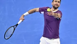 epa11903348 Marin Cilic of Croatia in action during his first round match against Carlos Alcaraz of Spain at the Qatar Open tennis tournament in Doha, Qatar, 17 February 2025. EPA/NOUSHAD THEKKAYIL