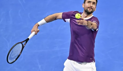 epa11903348 Marin Cilic of Croatia in action during his first round match against Carlos Alcaraz of Spain at the Qatar Open tennis tournament in Doha, Qatar, 17 February 2025. EPA/NOUSHAD THEKKAYIL