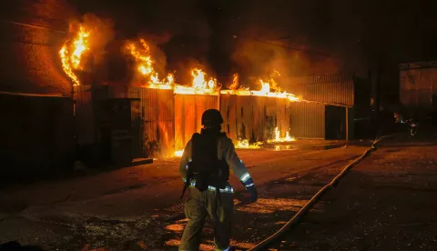 epa12048251 Rescuers work at the site of a drone strike in Kharkiv, Ukraine, early 23 April 2025, amid the ongoing Russian invasion. According to Ukraine's State Emergency Service, Russia carried out more than 130 shock drone strikes overnight on the Kharkiv, Poltava, Donetsk, Odesa, Dnipropetrovsk, and Zaporizhia regions. EPA/SERGEY KOZLOV