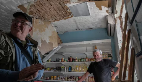 epa12052563 Residents try to repair their grocery shop after it was damaged in overnight shelling in Borova, a rural settlement in the Izium district, Kharkiv region, northeastern Ukraine, 24 April 2025, amid the Russian invasion. Situated about 10km from the frontline, Borova faces constant daily Russian shelling, which has repeatedly forced civil servants to relocate. Intensified attacks in the tense Kharkiv region in recent months have prompted authorities to evacuate Borova's civilian population to Kharkiv and Izyum. Approximately 500 people (10 percent of the original population) remain in the settlement, which was occupied by Russian troops at the start of the full-scale invasion and recaptured by the Ukrainian army in October 2022. EPA/MARIA SENOVILLA