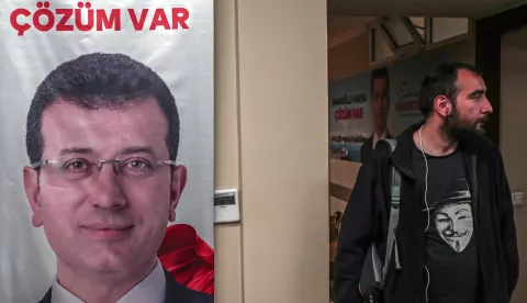 epa07551710 Supporter of main opposition Republican People's Party (CHP) stand near picture of the elected Istanbul Mayor Ekrem Imamoglu at CHP Istanbul headquarters in Istanbul, Turkey, 06 May 2019. According to reports, the Turkish Electoral Commission has ordered a repeat of the mayoral election in Istanbul. EPA/SEDAT SUNA