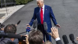 epa12008121 US President Donald Trump responds to a question from the media as he walks to board Marine One on the South Lawn of the White House in Washington, DC, USA, 03 April 2025. President Trump is traveling to Florida for the weekend. EPA/SHAWN THEW