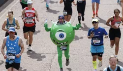 epa12058492 A person wearing a costume of Mike Wazowski from 'Monsters, Inc' film crosses the finish line of London Marathon in London, Britain, 27 April 2025. Taking place since 1981, the London Marathon is one of the most popular marathons in the world, with a record-breaking total of more than 56,000 people are expected to take part in the 2025 race. EPA/TOLGA AKMEN
