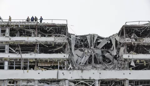 epa12013193 Ukrainian rescuers work at the site of a rocket hit in Kyiv, Ukraine, 06 April 2025, amid the ongoing Russian invasion. At least one person died and three other people were injured after an overnight combined rocket and shock drone attacks in Kyiv, according to the State Emergency Service report. Russian troops entered Ukrainian territory on 24 February 2022, starting a conflict that has provoked destruction and a humanitarian crisis. EPA/SERGEY DOLZHENKO