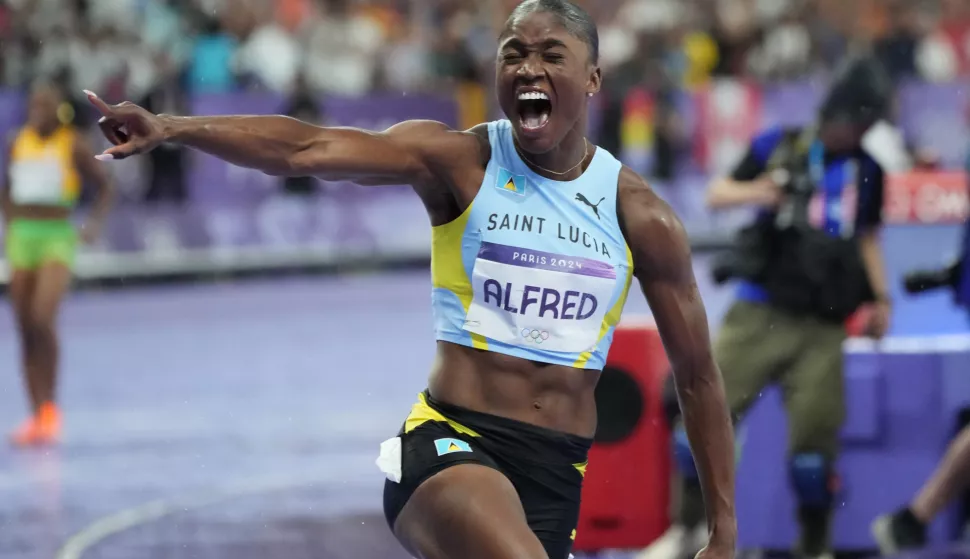 Julien Alfred of Saint Lucia celebrates after winning the gold medal in the Women's 100m Final during the Athletics competition at the Paris 2024 Olympic Games in Paris, France, on Saturday, August 3, 2024. Photo by Pat Benic/UPI Photo via Newscom Photo: Pat Benic/NEWSCOM