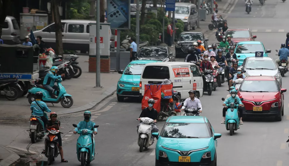 epa12045894 Electric cars and motorbikes move on a street in Hanoi, Vietnam 22 April 2025. Earth Day is celebrated annually on 22 April. The theme for Earth Day 2025 is 'Our Power, Our Planet,' calling on people to embrace renewable energy. EPA/LUONG THAI LINH