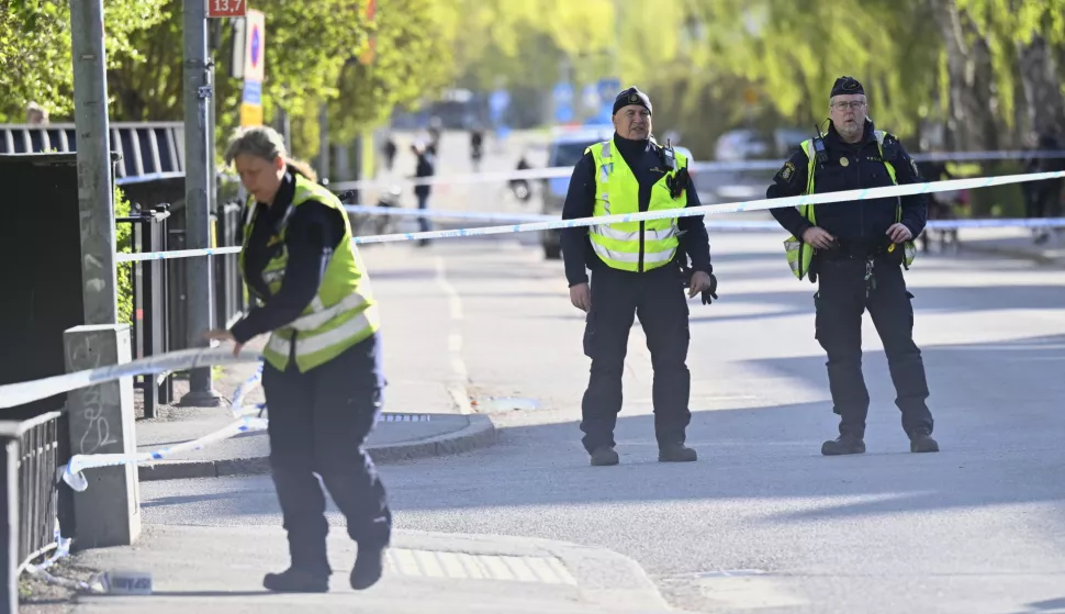 epa12064241 Police at the scene the day after after a shooting at Vaksala Square in central Uppsala, Sweden, 30 April 2025. According to police, three people were confirmed dead after a shooting on 29 April, which is being investigated as a murder. EPA/FREDRIK SANDBERG SWEDEN OUT