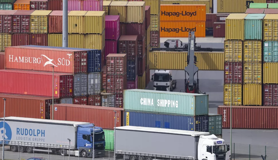 epa12022795 Shipping containers are stacked at the Duisport in Duisburg, Germany, 10 April 2025. US President Trump on 09 April has paused for 90 days the implementation of higher tariffs announced on 02 April for most countries, except China whose tariff has increased to 125 percent. EPA/CHRISTOPHER NEUNDORF