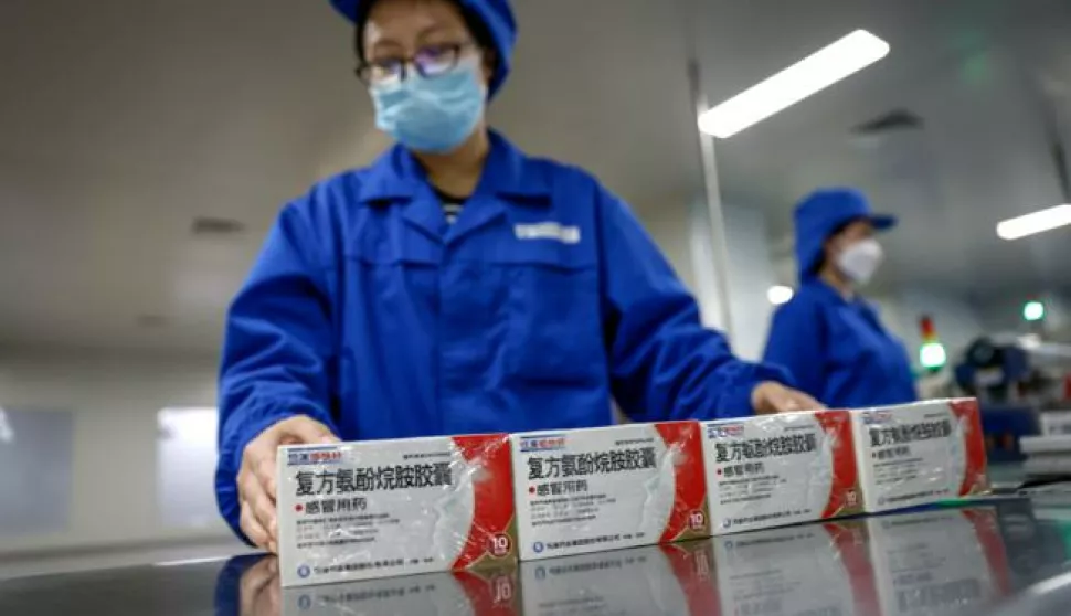 epa10398011 Workers prepare to pack anti-fever tablets at the Youcare Pharmaceutical Group office during a government-organized media tour in Beijing, China, 10 January 2023. Chinese officials have said that most of the country's populous areas have reached the peak of the COVID-19 as cases have been declining in Beijing and several provinces. EPA/MARK R. CRISTINO