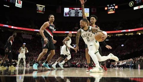 Jan 31, 2024; Portland, Oregon, USA; Milwaukee Bucks guard Damian Lillard (0) drives to the basket during the first half against Portland Trail Blazers guard Anfernee Simons (1) at Moda Center. Mandatory Credit: Troy Wayrynen-USA TODAY Sports/Sipa USA Photo: USA Today Sports/SIPA USA