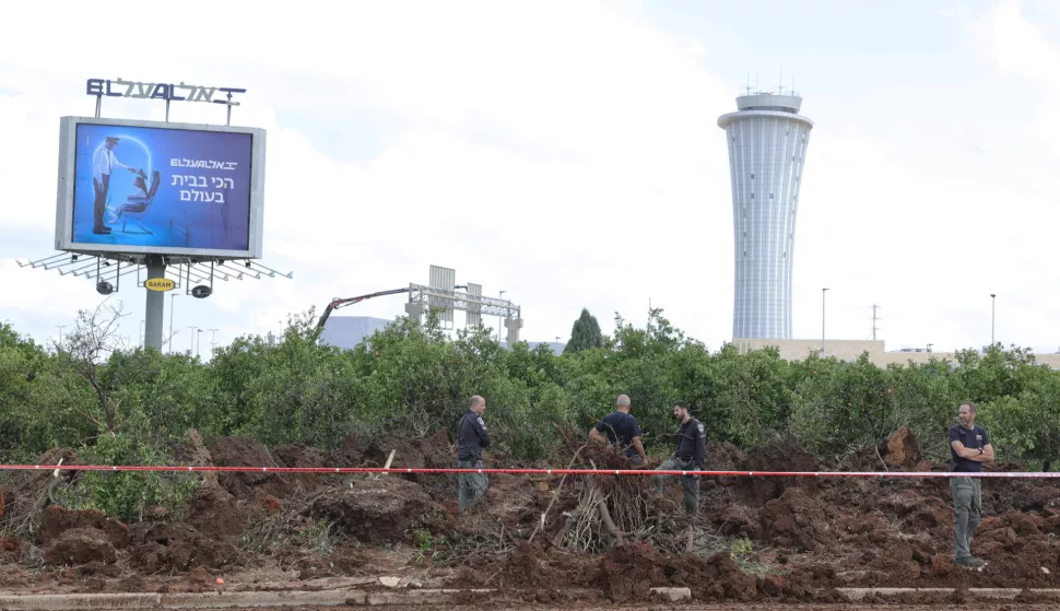 epa12072578 Police inspect the damage caused by a ballistic missile fired from Yemen at the Ben Gurion airport near Tel Aviv, Israel, 04 May 2025. According to Israel's military spokesperson, a ballistic missile fired from Yemen hit at the Ben Gurion airport. Yemen's Houthis have claimed responsibility for launching the missile. EPA/ABIR SULTAN