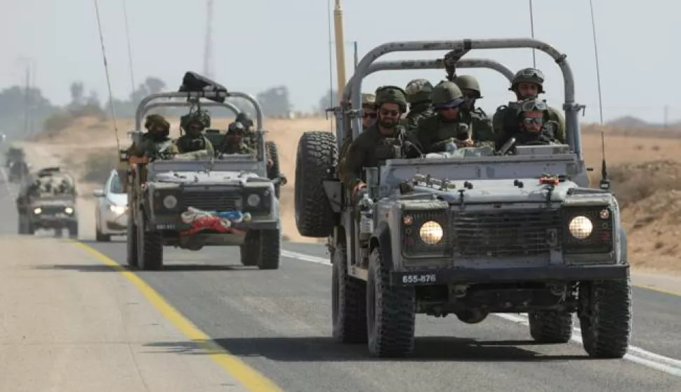 epa10912985 Israeli soldiers drive along the border with Gaza near the southern city of Ofakim,11 October 2023. More than 1,200 Israelis have been killed and over 2,800 others injured, according to the Israel Defense Forces (IDF), since the Islamist movement Hamas launched attacks on Israel from the Gaza Strip on 07 October. More than 3,000 people, including 1,500 militants from Hamas, have been killed and thousands injured in both Gaza and Israel since the conflict erupted, according to Israeli military sources and Palestinian officials. EPA/ABIR SULTAN