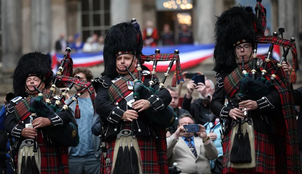 epa12072937 Members of the Scots Guards Association Pipes & Drums perform in front of Liverpool Town Hall during Victory in Europe Day (VE Day) 80th celebrations in Liverpool, Britain, 04 May 2025. VE Day will mark its 80th anniversary on 08 May 2025, when Nazi Germany surrendered unconditionally to the Allied Forces. EPA/ADAM VAUGHAN