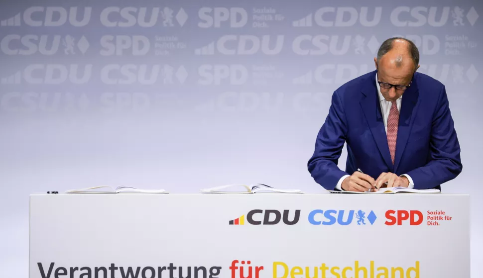 epaselect epa12074683 Designated Chancellor and Chairman of the Christian Democratic Union (CDU) party Friedrich Merz signs the coalition agreement during an event to sign a coalition agreement for a new German government in Berlin, Germany, 05 May 2025. The new German government will be formed between the Union parties of Christian Democratic Union (CDU) and Christian Social Union (CSU) and the coalition partner Social Democratic Party (SPD). EPA/CLEMENS BILAN