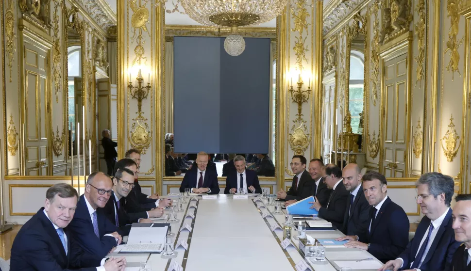 epa12079874 German Chancellor Friedrich Merz (2-L) attends a meeting with French President Emmanuel Macron (3-R) at the Elysee Palace in Paris, France, 07 May 2025. The German Chancellor visits France and Poland the day after his election. EPA/LUDOVIC MARIN/POOL MAXPPP OUT
