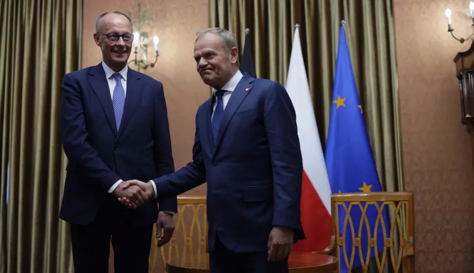 epa12081387 Polish Prime Minister Donald Tusk (R) meets with German Chancellor Friedrich Merz (L) at the prime minister's office in Warsaw, Poland, 07 May 2025. The German Chancellor visits France and Poland the day after his election. EPA/HANNIBAL HANSCHKE/POOL
