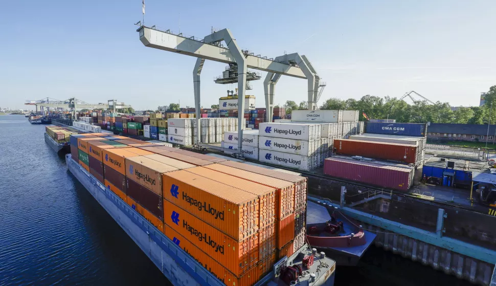 epa12064186 Shipping containers stacked at the Rhine-Neckar commercial port in Mannheim, Germany, 30 April 2025. The port of Mannheim is one of the most important inland ports in Europe. EPA/RONALD WITTEK