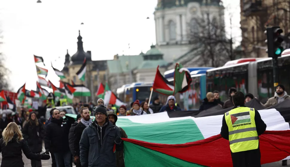 epa11160991 Protesters take part in a demonstration organized by 'Together for Palestine' demanding cease-fire in Gaza and to exclude Israel from the Eurovision Song Contest, in central Stockholm, Sweden, 17 February 2024. Thousands of Israelis and Palestinians have been killed since the militant group Hamas launched an unprecedented attack on Israel from the Gaza Strip on 07 October 2023, and the Israeli strikes on the Palestinian enclave EPA/FREDERIK PERSSON SWEDEN OUT