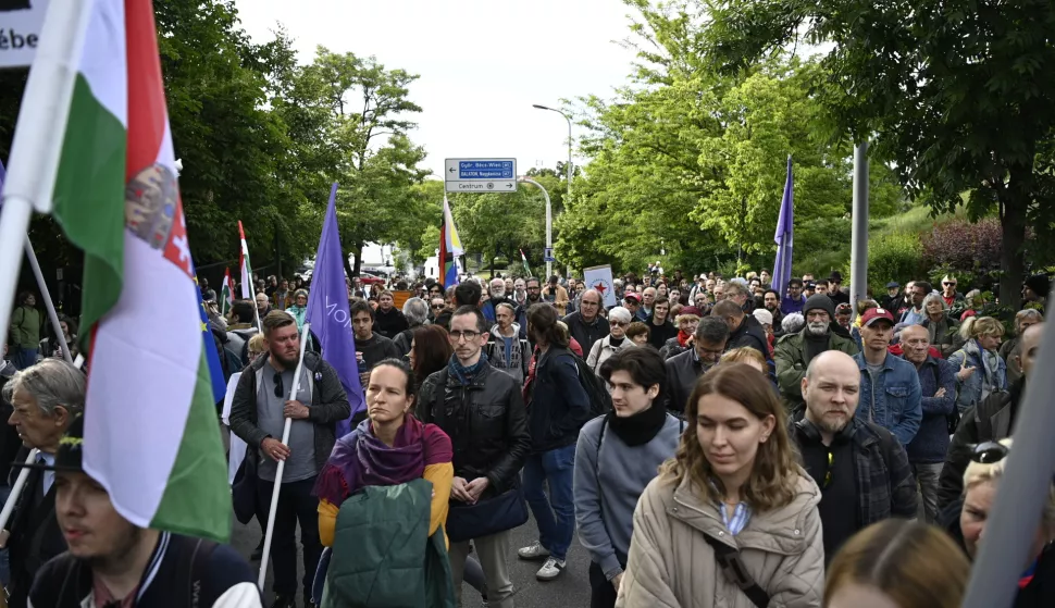 epa12107207 People attend a protest by Momentum Movement entitled 'Free Country, Free Press, Free Elections', which was held against the adoption of the bill On The Transparency Of Public Life in front of the Office for the Protection of Sovereignty in Budapest, Hungary, 16 May 2025. EPA/Boglarka Bodnar HUNGARY OUT