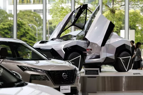 epa12095507 Vehicles are displayed at the showroom of Nissan Motor Co. headquarters in Yokohama, Japan, 13 May 2025. In April 2025 Nissan released a statement saying that it has significantly lowered its financial forecast for the fiscal year ending March 31, 2025. In addition, Nissan anticipates a net loss of 700-750 billion yen for the current fiscal year ending March 31, 2024. EPA/FRANCK ROBICHON