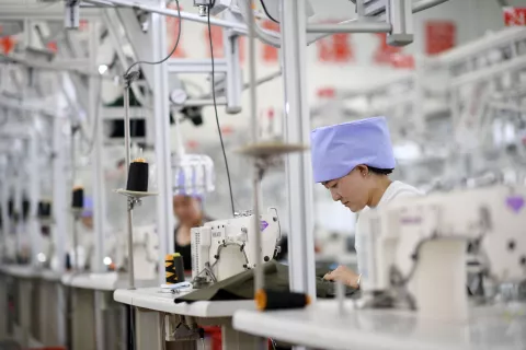 CHINA-NINGXIA-TONGXIN-POVERTY ALLEVIATION-INDUSTRIAL PARK (CN) (180625) -- TONGXIN, June 25, 2018 (Xinhua) -- A worker makes clothes at a factory in a poverty alleviation industrial park in Tongxin County, Wuzhong City of northwest China's Ningxia Hui Autonomous Region, June 23, 2018."n The industrial park aiming to alleviate poverty in the region was set up in 2014, which has provided more than 1,300 job opprtunities so far. (Xinhua/Wang Peng) (lb) Wang Peng Photo: XINHUA/PIXSELL
