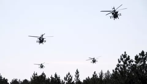 epa12069452 US Army's AH-64D Apache attack helicopters conduct aerial gunnery training at Adazi Military training ground in Latvia, 02 May 2025. During the training, the final stage of the regular certification process also took place which will certify that Apache helicopter crews are capable of conducting combat operations, firing and neutralizing various types of targets Ð stationary and moving. EPA/VALDA KALNINA