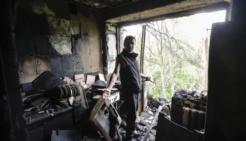 epa12129849 A resident inside his damaged flat in a five-storey residential building struck by a drone in Kyiv, Ukraine, 24 May 2025, amid the ongoing Russian invasion. Nobody was killed, but at least 15 people were injured in overnight strikes on multiple residential areas of Kyiv, according to the State Emergency Service. Russia launched a large-scale attack using at least 14 ballistic missiles and 250 drones across Ukraine. EPA/SERGEY DOLZHENKO