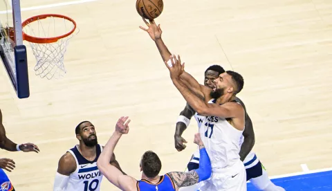 epa12127308 Minnesota Timberwolves center Rudy Gobert (R) shoots the ball during the second half of the Western Conference finals playoff game one between the Minnesota Timberwolves and the Oklahoma City Thunder at the Paycom Center in Oklahoma City, Oklahoma, USA, 22 May 2025. EPA/GERALD LEONG SHUTTERSTOCK OUT