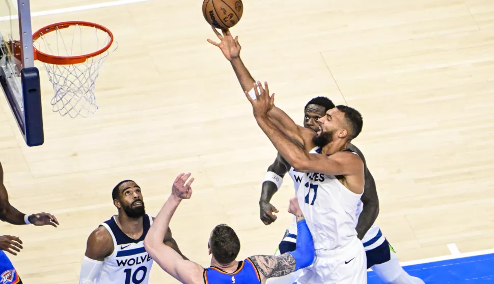 epa12127308 Minnesota Timberwolves center Rudy Gobert (R) shoots the ball during the second half of the Western Conference finals playoff game one between the Minnesota Timberwolves and the Oklahoma City Thunder at the Paycom Center in Oklahoma City, Oklahoma, USA, 22 May 2025. EPA/GERALD LEONG SHUTTERSTOCK OUT