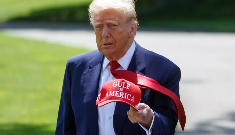 epa12063428 US President Donald Trump walks holding a 'Gulf of America' baseball cap on the South Lawn of the White House before departing to Michigan, in Washington, DC, USA, 29 April 2025. President Trump is due to host a rally in Michigan to mark 100 days since the start of his second term. EPA/WILL OLIVER