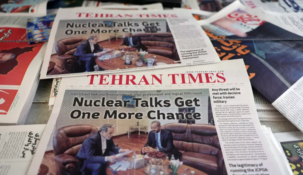 epa12129864 Copies of the Iranian daily newspaper Tehran Times carrying a picture of Iranian Foreign Minister Abbas Araghchi and Omani Foreign Minister Badr Albusaidi during the Iran and US indirect talks in Rome, in a kiosk, in Tehran, Iran, 24 May 2025. Iran and the US conducted a fifth round of talks in Rome on 23 May 2025, which Omani Foreign Minister Badr Albusaidi, the mediator of the negotiations, described as concluding 'with some but not conclusive progress.' EPA/ABEDIN TAHERKENAREH