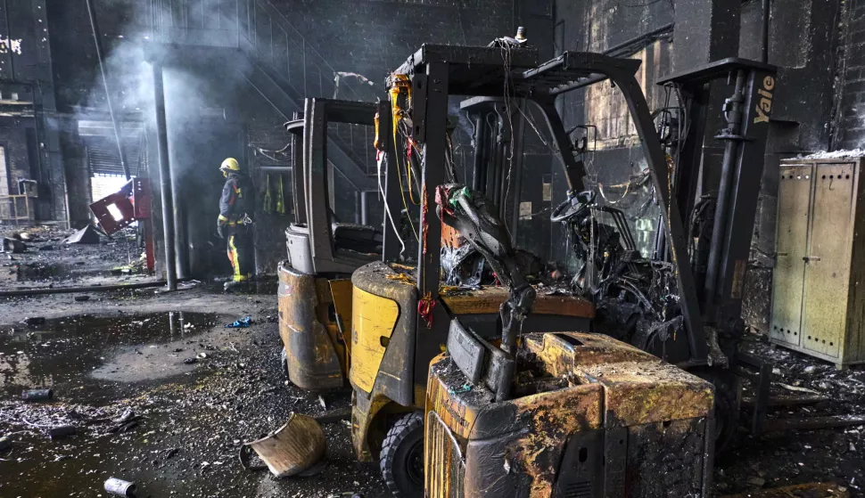 epa12136795 Ukrainian firefighters and rescuers work at the site of a damaged storage facility of a private factory following an overnight attack in Vasyshcheve, near Kharkiv, Ukraine, 26 May 2025, amid the ongoing Russian invasion. According to the Ukraine's State Emergency Service, Russia launched early on 26 May another large-scale attack with over 300 drones across Ukraine, with a warehouse destroyed and set on fire as a result on the outskirts of Kharkiv. EPA/SERGEY KOZLOV