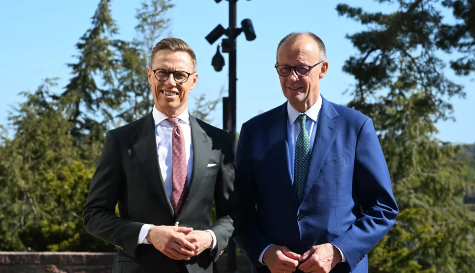 epa12138157 President of Finland Alexander Stubb (L) welcomes Germany's Chancellor Friedrich Merz in Turku, Finland, 27 May 2025. EPA/KIMMO BRANDT