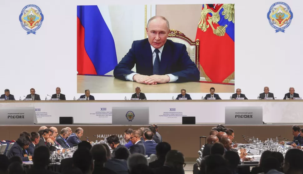 epa12140123 Russian President Vladimir Putin appears on a screen as he addresses the 13th International Meeting of High-Ranking Officials Responsible for Security Matters at the Russia National Centre in Moscow, Russia, 28 May 2025. More than 125 delegations from more than 100 countries are scheduled to attend the 13th International Meeting of High Representatives for Security Issues running from 27 to 29 May. EPA/MAXIM SHIPENKOV