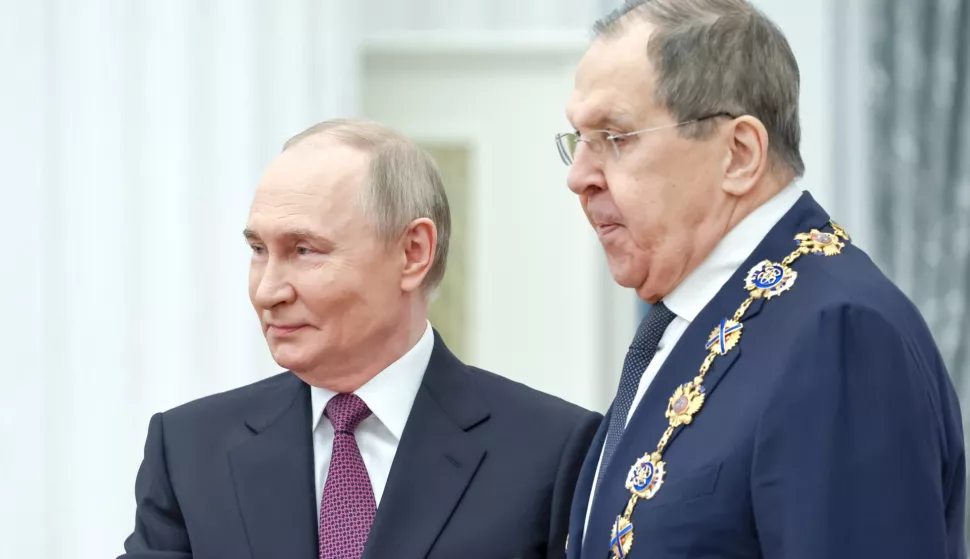 epa12125806 Russian President Vladimir Putin (L) awards Foreign Minister Sergey Lavrov with the Order of St. Andrew the Apostle the First-Called during a ceremony at the Kremlin Senate Palace in Moscow, Russia, 22 May 2025. EPA/ALEXANDER KAZAKOV/SPUTNIK/KREMLIN POOL MANDATORY CREDIT