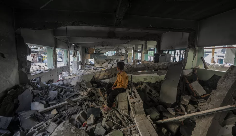 epa12136568 An internally displaced Palestinian boy sits at the destroyed building of Al Jerjawi school following Israeli airstrike in Al Daraj neighborhood in Gaza City on 26 May 2025. According to the Palestinian Health Ministry in Gaza over 30 Palestinians were killed in the airstrike in the early hours of the morning. More than 53,900 Palestinians have been killed in the Gaza Strip, according to the Palestinian Ministry of Health, since Israel launched a military campaign in the strip in response to a cross-border attack led by the Palestinian militant group Hamas on 07 October 2023, in which about 1,200 Israelis were killed and more than 250 taken hostage. EPA/MOHAMMED SABER