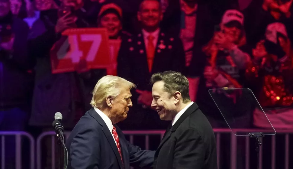 epaselect epa11837518 US President-elect Donald Trump (L) with businessman Elon Musk (R) on stage during a rally at Capital One Arena in Washington, DC, USA, 19 January 2025. President-elect Donald Trump, who defeated Joe Biden to become the 47th president of the United States, will be inaugurated on 20 January, though all of the planned outdoor ceremonies and events have been cancelled due to a forecast of extreme cold temperatures. EPA/WILL OLIVER